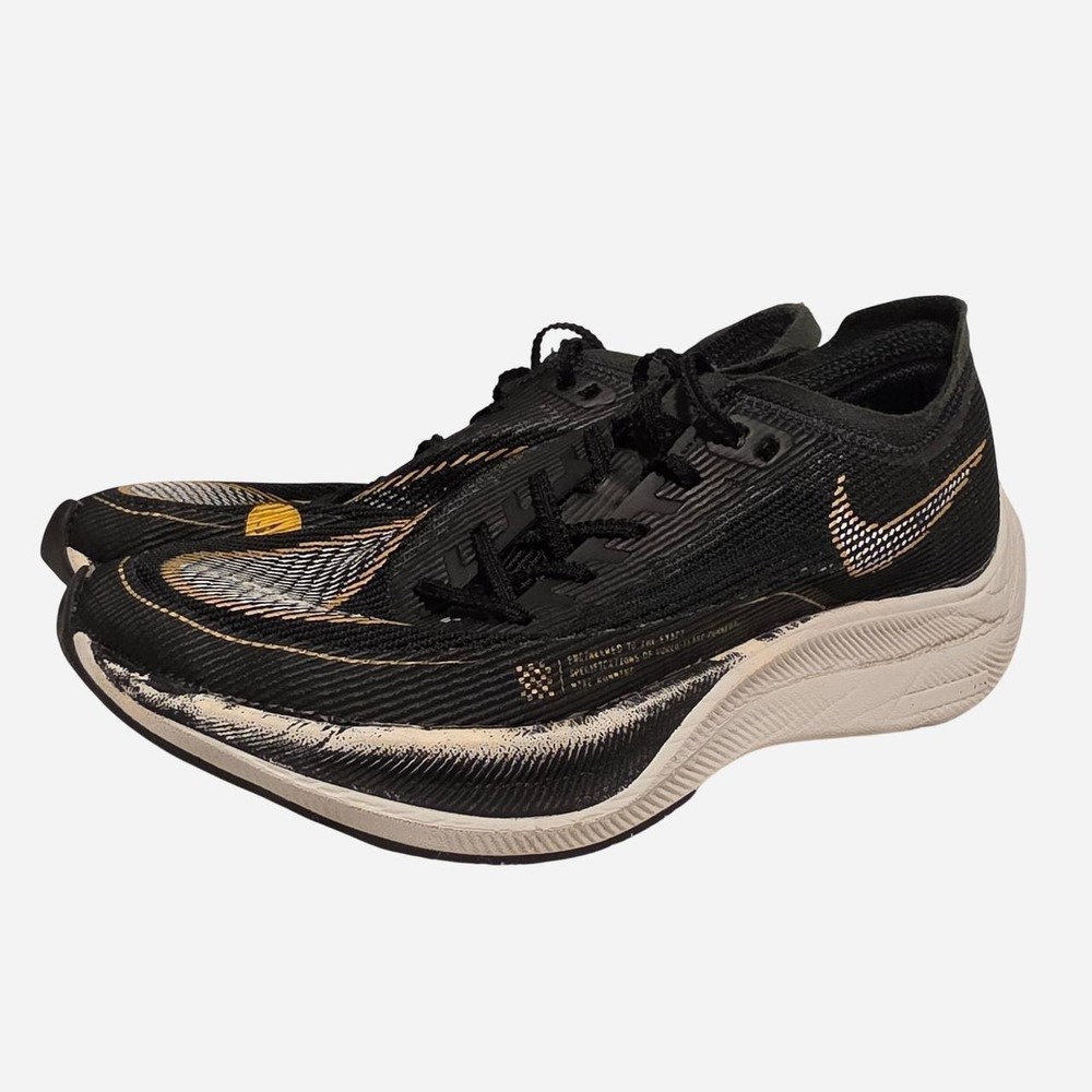 Nike ZoomX Vaporfly Next% 3 black running shoes with white and gold accents
